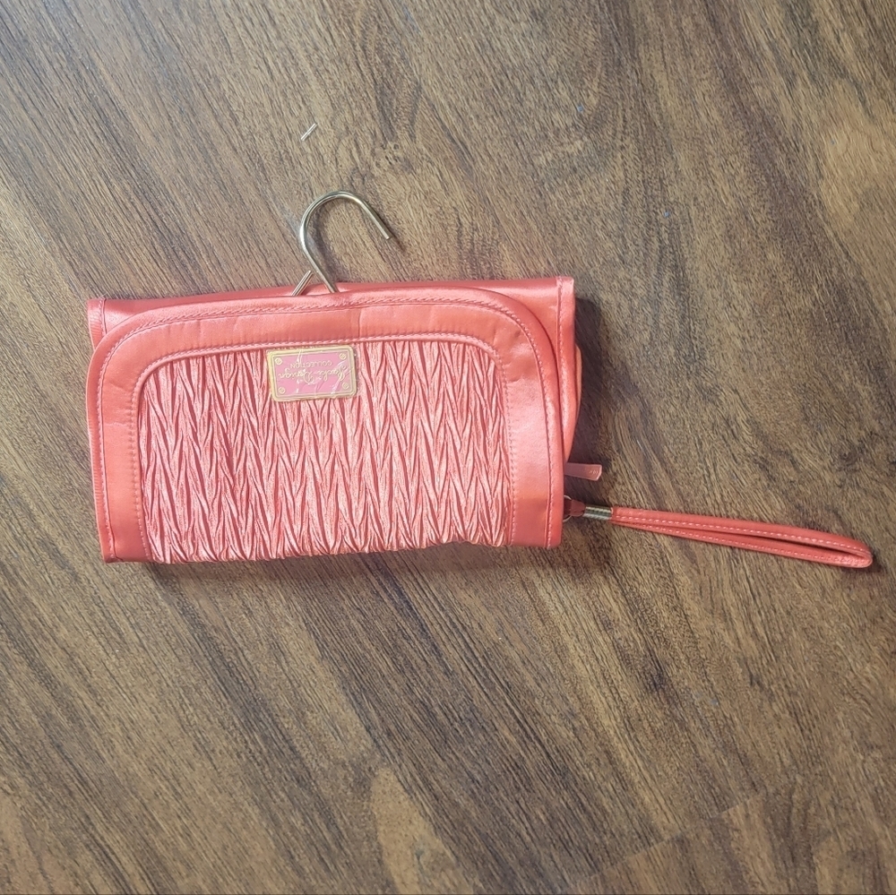 34. Jacki design travel cosmetic bag coral colored New without tags